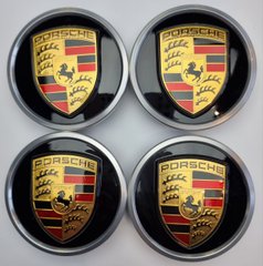 A set of original Porsche Taycan center caps