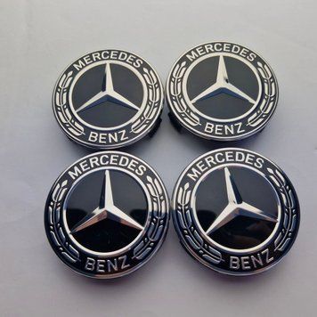 A set of original Mercedes A2224002100 center caps