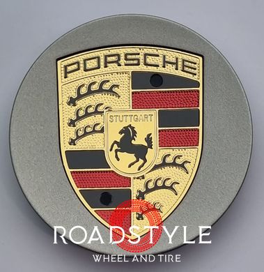 A set of original Porsche Macan center caps