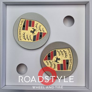 A set of original Porsche Macan center caps