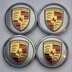 A set of original Porsche Taycan center caps