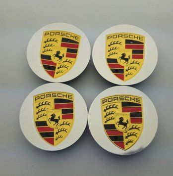 A set of original Porsche Cayenne/Panamera center caps