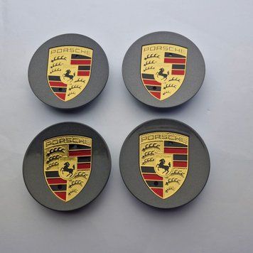 A set of original Porsche Cayenne/Panamera center caps